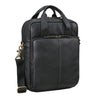 schwarze Ledertasche und Handgepäck